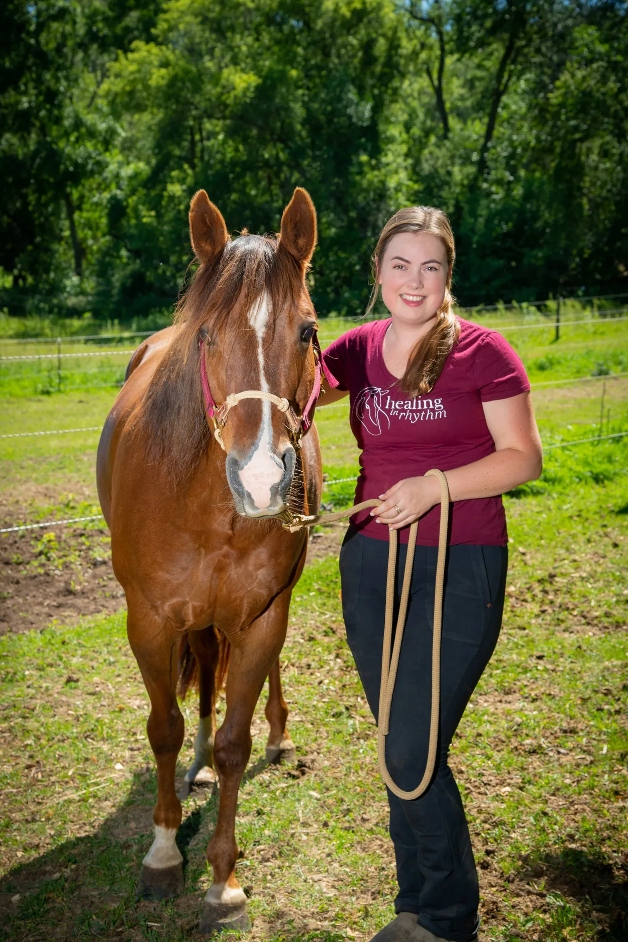 Katelynn Betts standing with her horse Candy